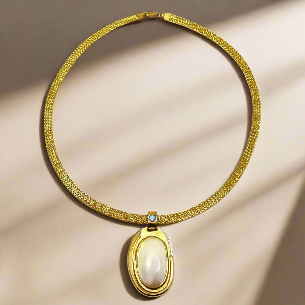 Necklace with a 18k gold medallion mother of pearl and a bleu topaz in a hand made 14k. gold chain - Dinos-Virginia