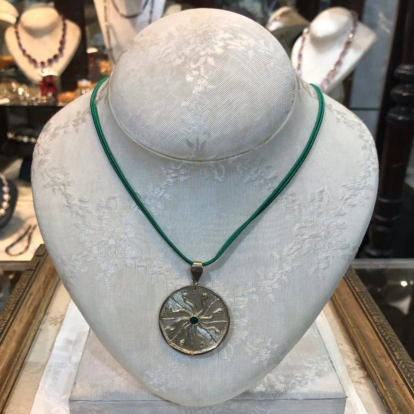 Pendant in Sterling Silver and 14k Gold with a green round stone