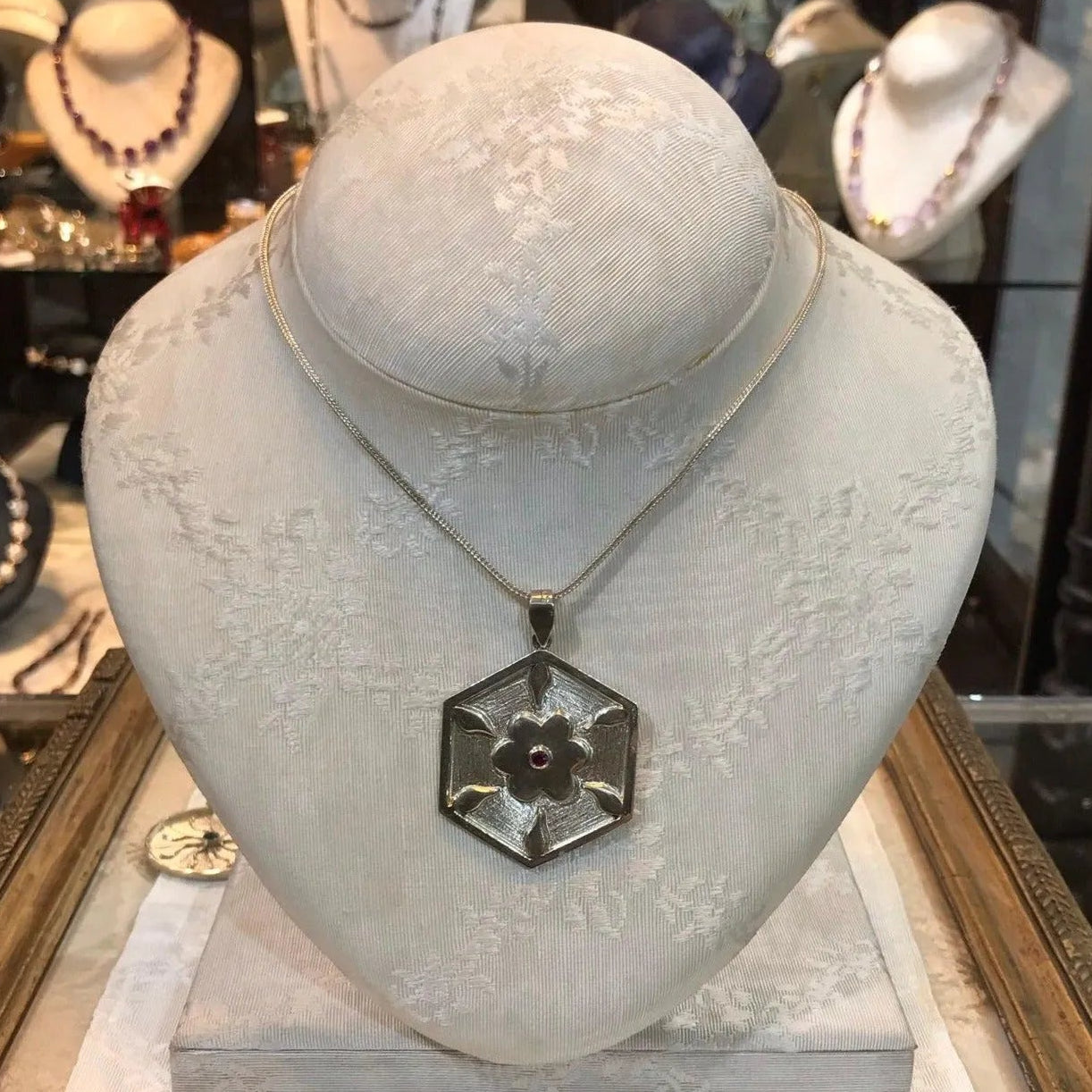 Pendant in Sterling Silver and 14k Gold with a round ruby stone