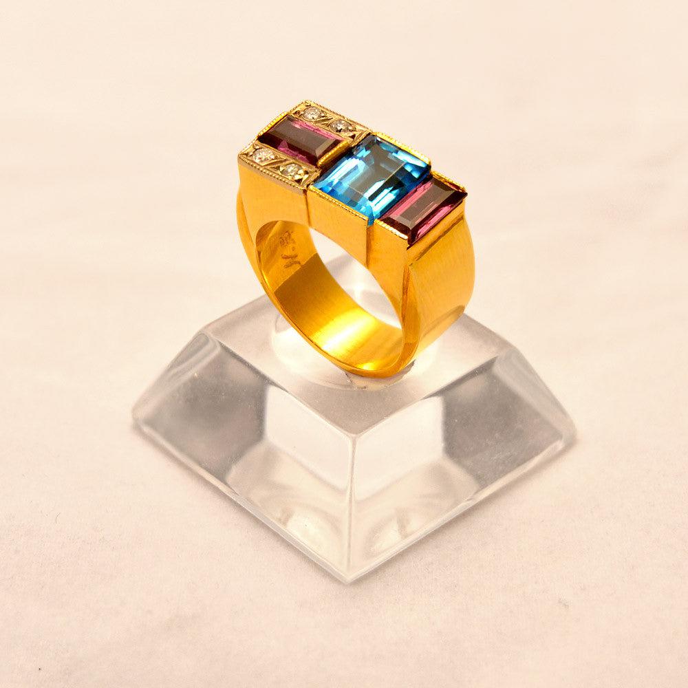 Ring in 18k Gold with Bleu Topaz 35c Tourmalines 35c and Brilliants 0.05 c. (B-72)