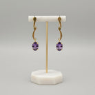 Amethyst oval faceted cutaneous 18k gold earrings