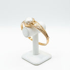 Bracelet in 18k gold with a mabe pearl