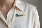 Brooch in 18k gold with Black Ostrich Tahitian pearl, fish design brooch