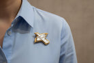 Brooch in 18k gold with a baroque pearl