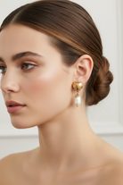 Earrings in 18k gold with pearl