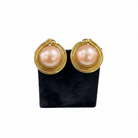 Earrings in 18k gold with pink pearl