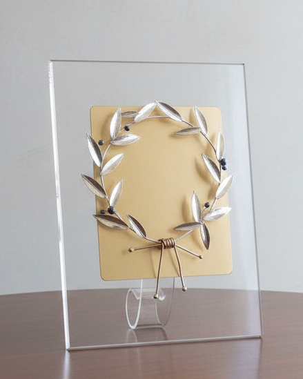 Decorative piece on a wooden table with a plain background