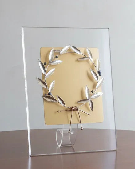 Decorative piece on a wooden table with a plain background