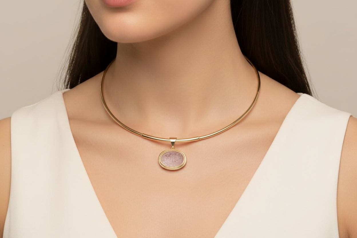 Necklace in 14k gold with a seal stone on a chalcedony