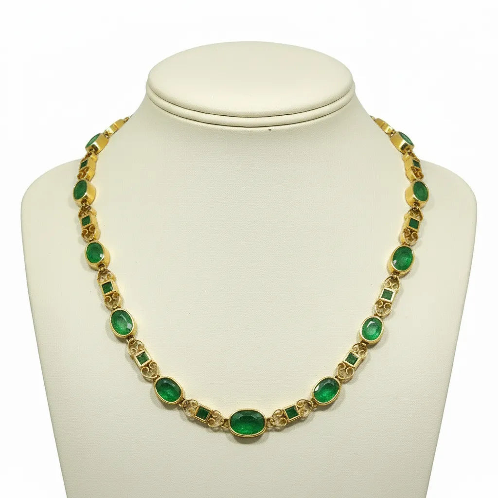 Necklace in 18k gold Perforated with Zambian emeralds