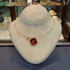 Necklace in 18k gold and a flower pendant with enamel