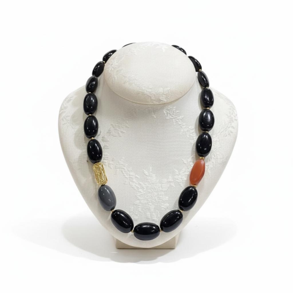 Necklace in Obsidian & Carnelian gemstones with 18k gold elements