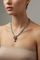 Necklace in turquoise stones and coral stones, coral stone in rose design, white 18k gold