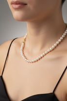 Necklace with white Aqua pearls and 18k gold closure
