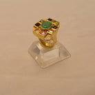 Ring in 18k Gold with a Zambian emerald and pyramid cut tourmalines (B-06)