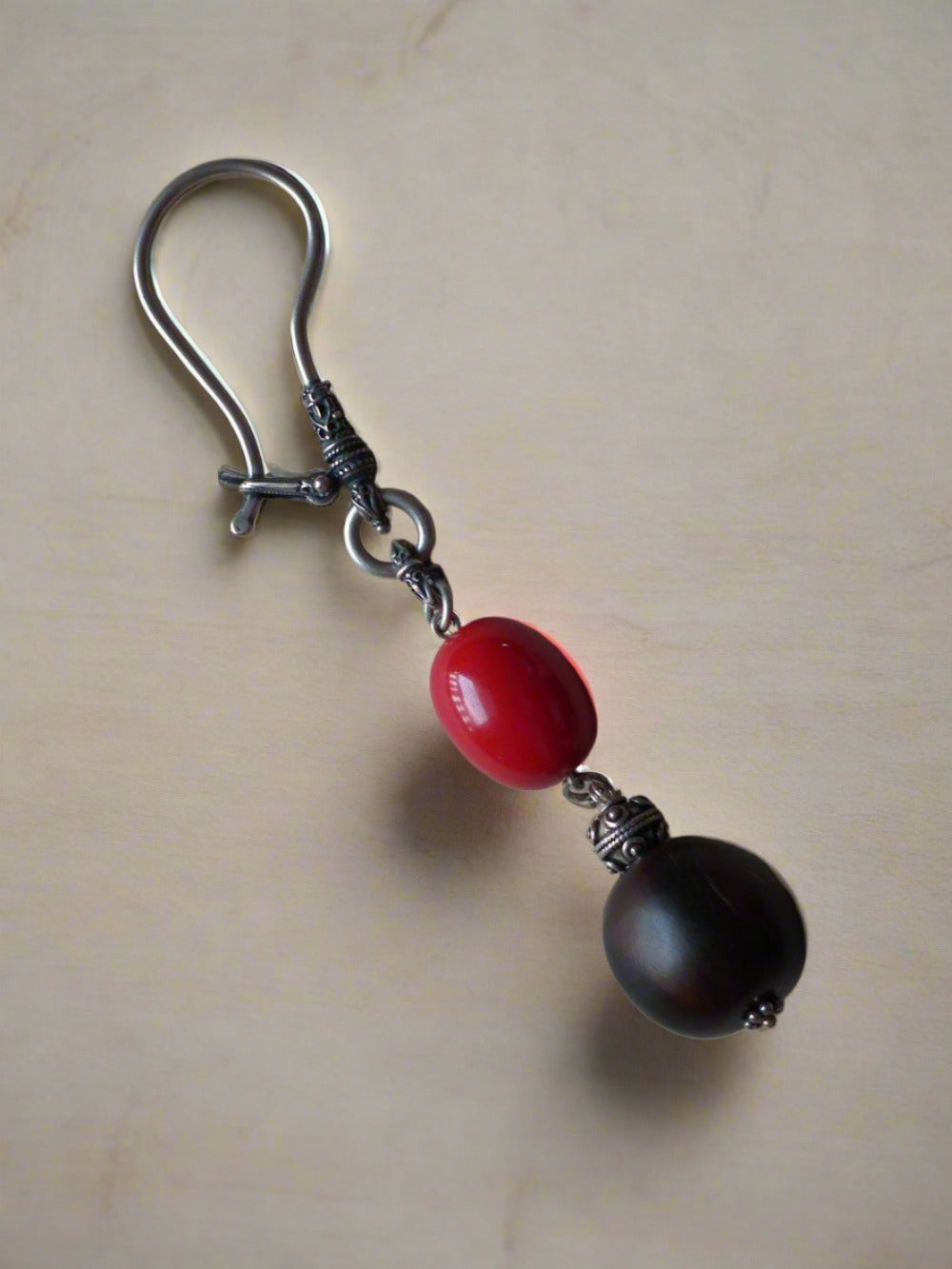 Keychain in sterling silver with red amber and horn