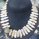 Necklace with baroque pearls and 14k gold close with an aquamarine cabochon stone